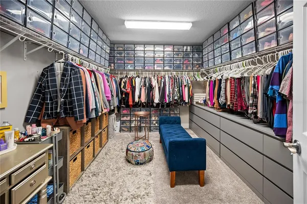a bathroom with double vanity sinks a mirror and a shower