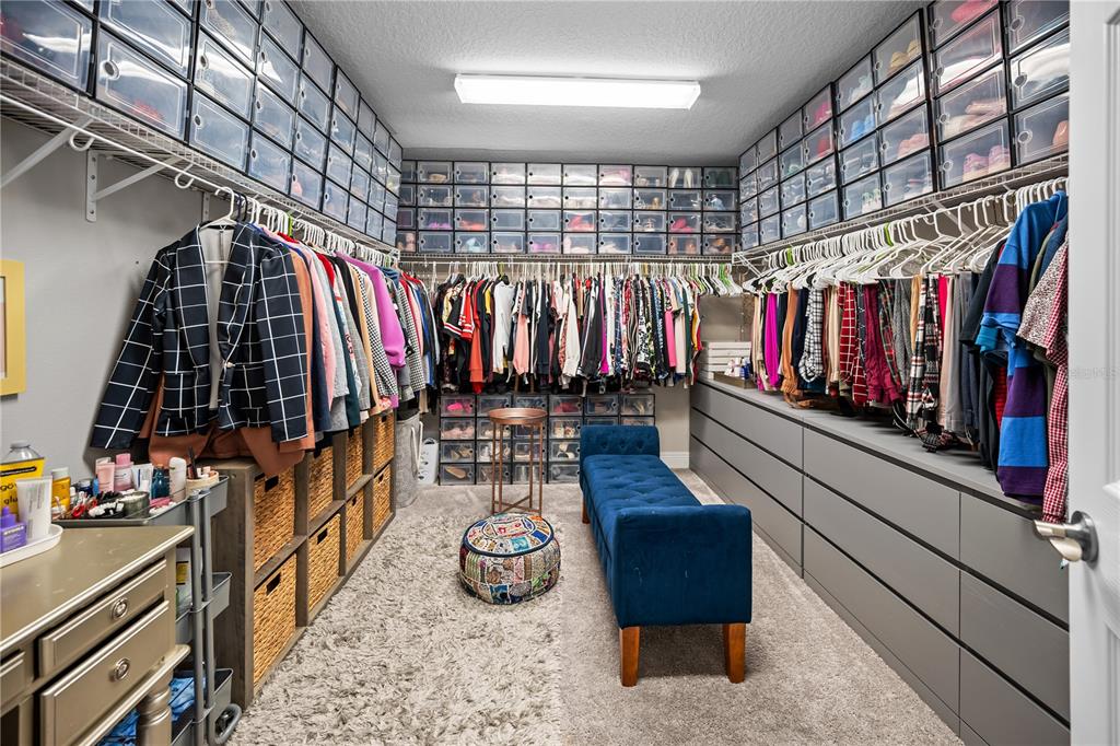14734 Horse Trot Road Lithia, FL 33547 - Photo 40 of 66 a view of walk in closet with clothes and shoes