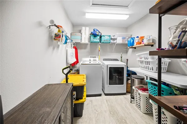 an aerial view of a house with a garden and lake view