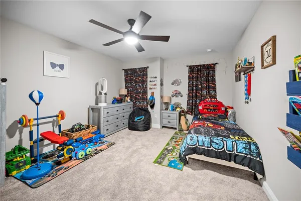 an aerial view of a house with a garden and mountain view