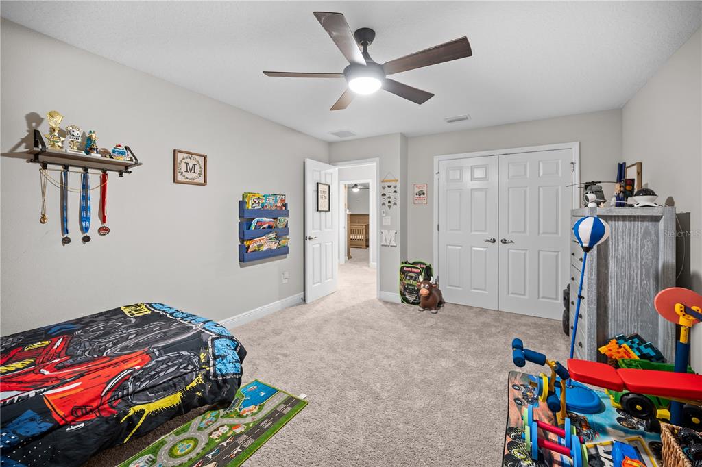 14734 Horse Trot Road Lithia, FL 33547 - Photo 46 of 66 a bedroom with bed and a window
