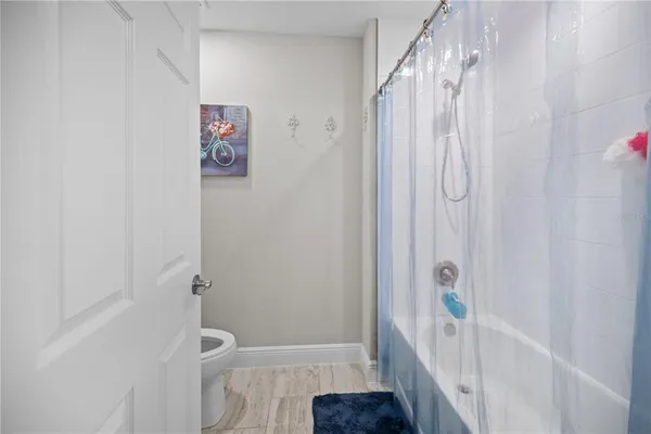 an aerial view of a house with outdoor space lake view and mountain view