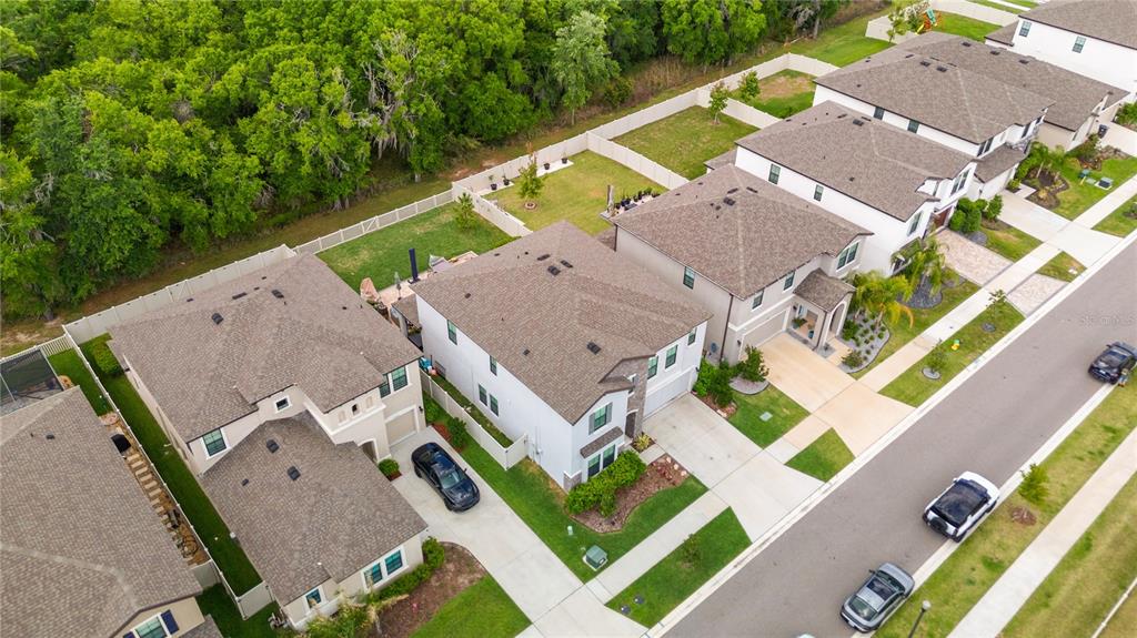 14734 Horse Trot Road Lithia, FL 33547 - Photo 55 of 66 an aerial view of a house with a garden and lake view