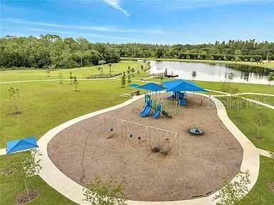 14734 Horse Trot Road Lithia, FL 33547 - Photo 65 of 66 an aerial view of a house with outdoor space lake view and mountain view
