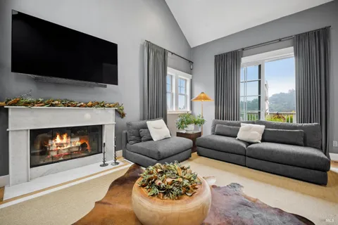 a bedroom with a large bed and a couch