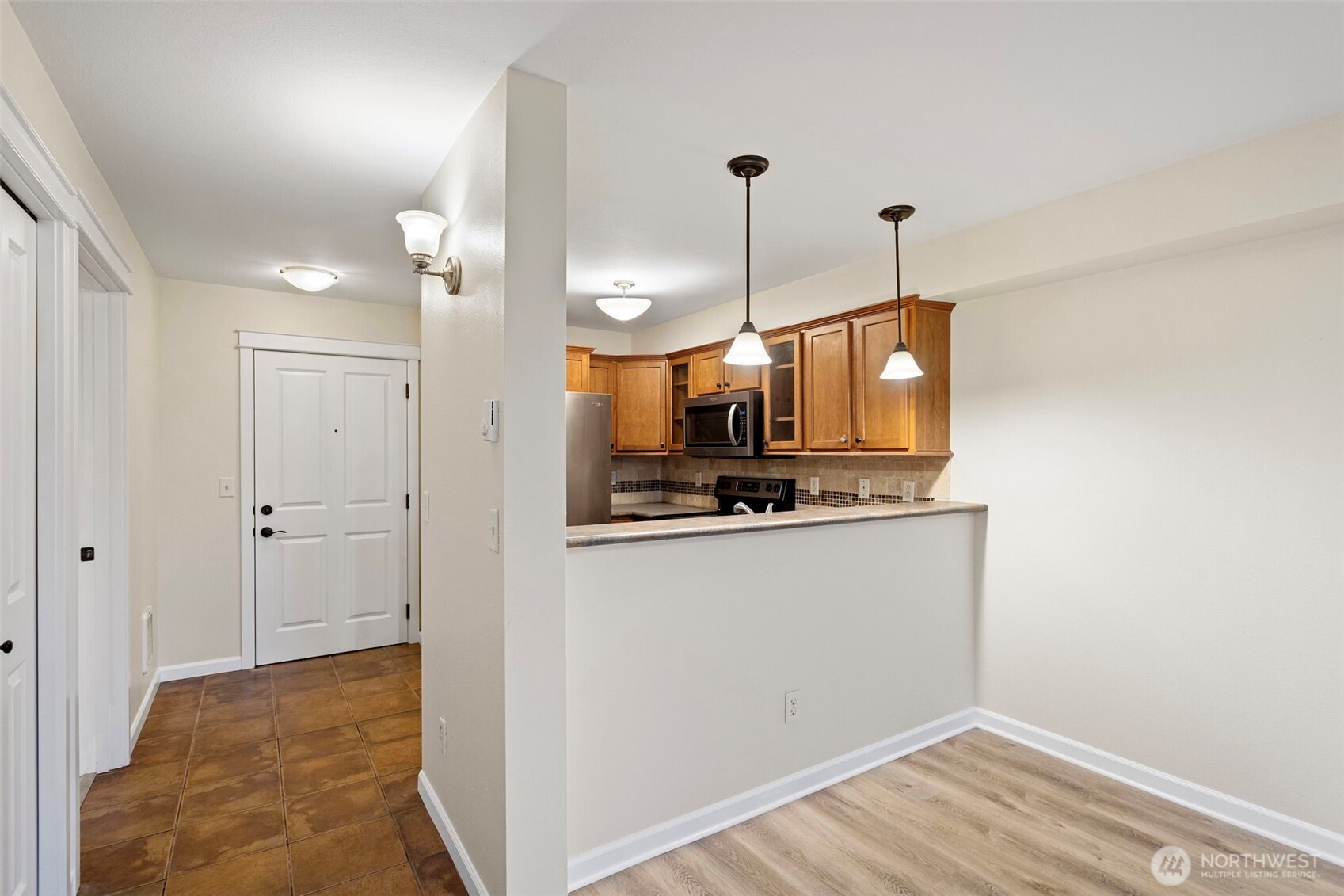 700 32nd Street, Unit A310 Bellingham, WA 98225 - Photo 4 of 12 a view of a room with wooden floor and kitchen view
