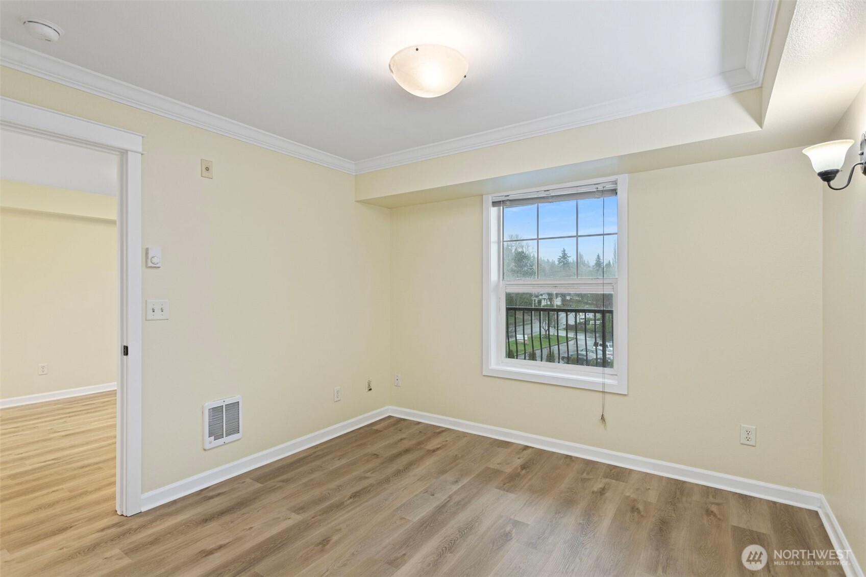 700 32nd Street, Unit A310 Bellingham, WA 98225 - Photo 8 of 12 an empty room with wooden floor and windows