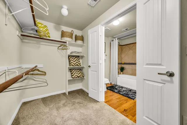 a bathroom with a tub and shower
