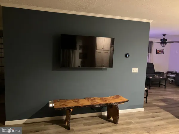 a room with furniture and view of bathroom