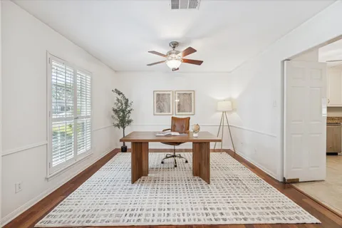 a work room with furniture and wooden floor