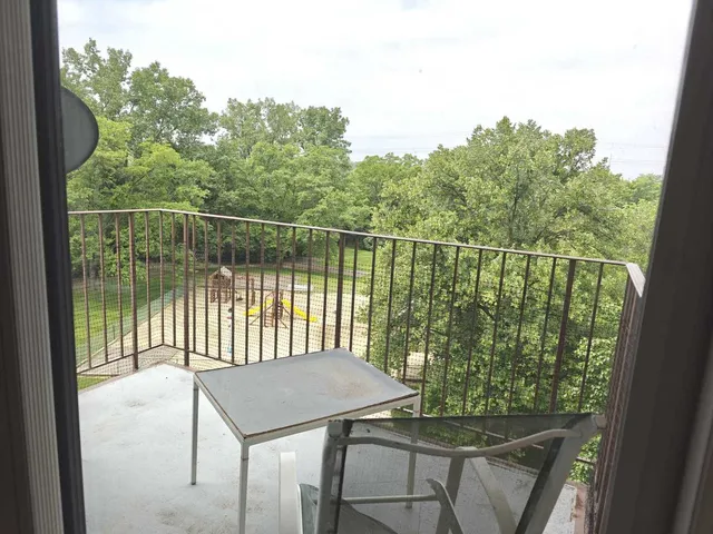 a balcony with a yard