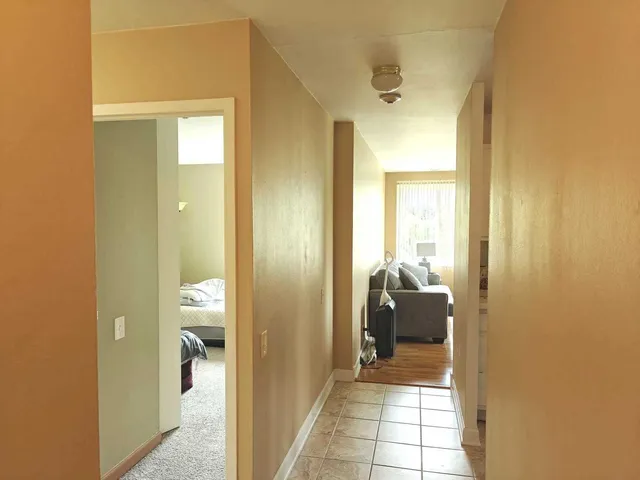 a bathroom with a glass door shower and a sink