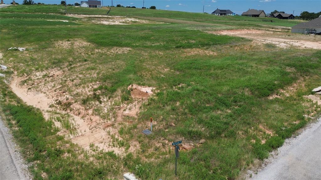 3001 Westfork Way Springtown, TX 76082 - Photo 6 of 7 a backyard of a house with a yard and outdoor seating