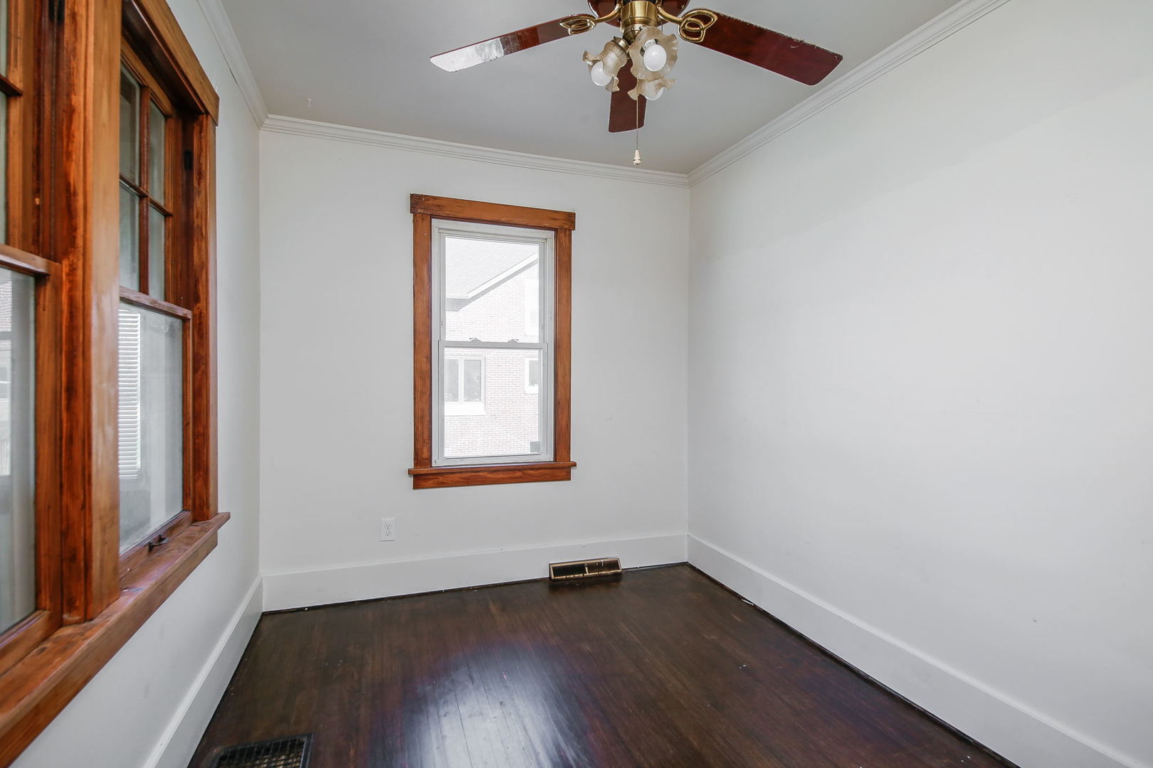 10N835 Rippburger Road Elgin, IL 60124 - Photo 11 of 20 an empty room with wooden floor chandelier and windows
