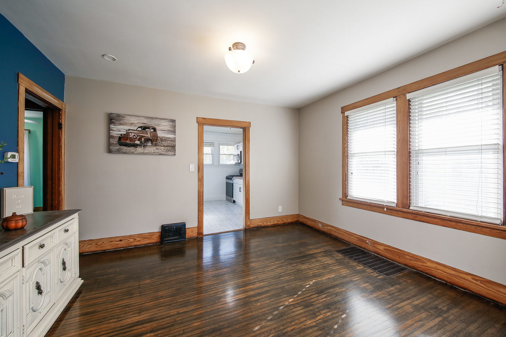 10N835 Rippburger Road Elgin, IL 60124 - Photo 7 of 20 wooden floor in an empty room with a window