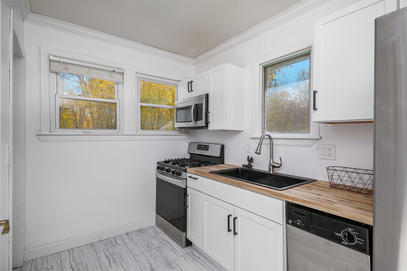 10N835 Rippburger Road Elgin, IL 60124 - Photo 9 of 20 a kitchen with stainless steel appliances granite countertop a sink stove and microwave