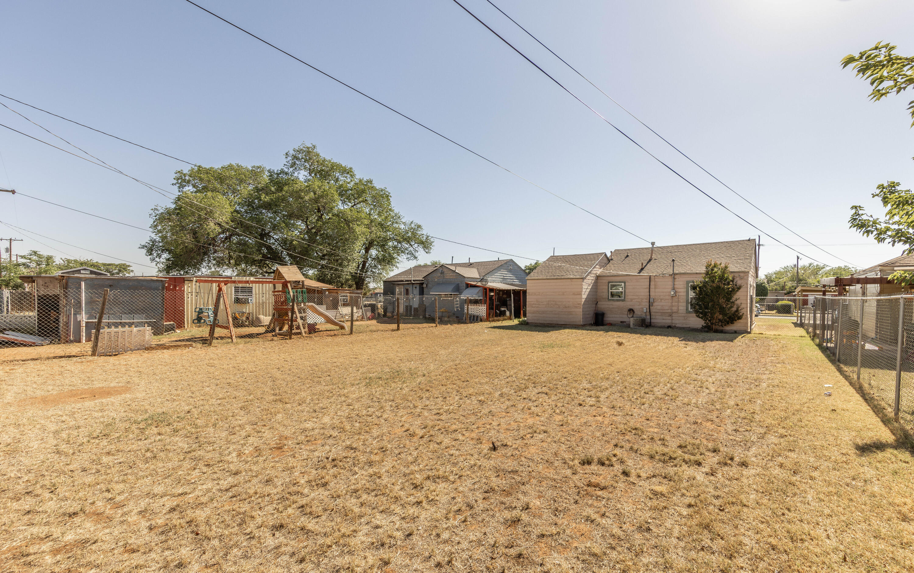 110 Uvalde Avenue Lubbock, TX 79415 - Photo 13 of 15 a street view with tall buildings