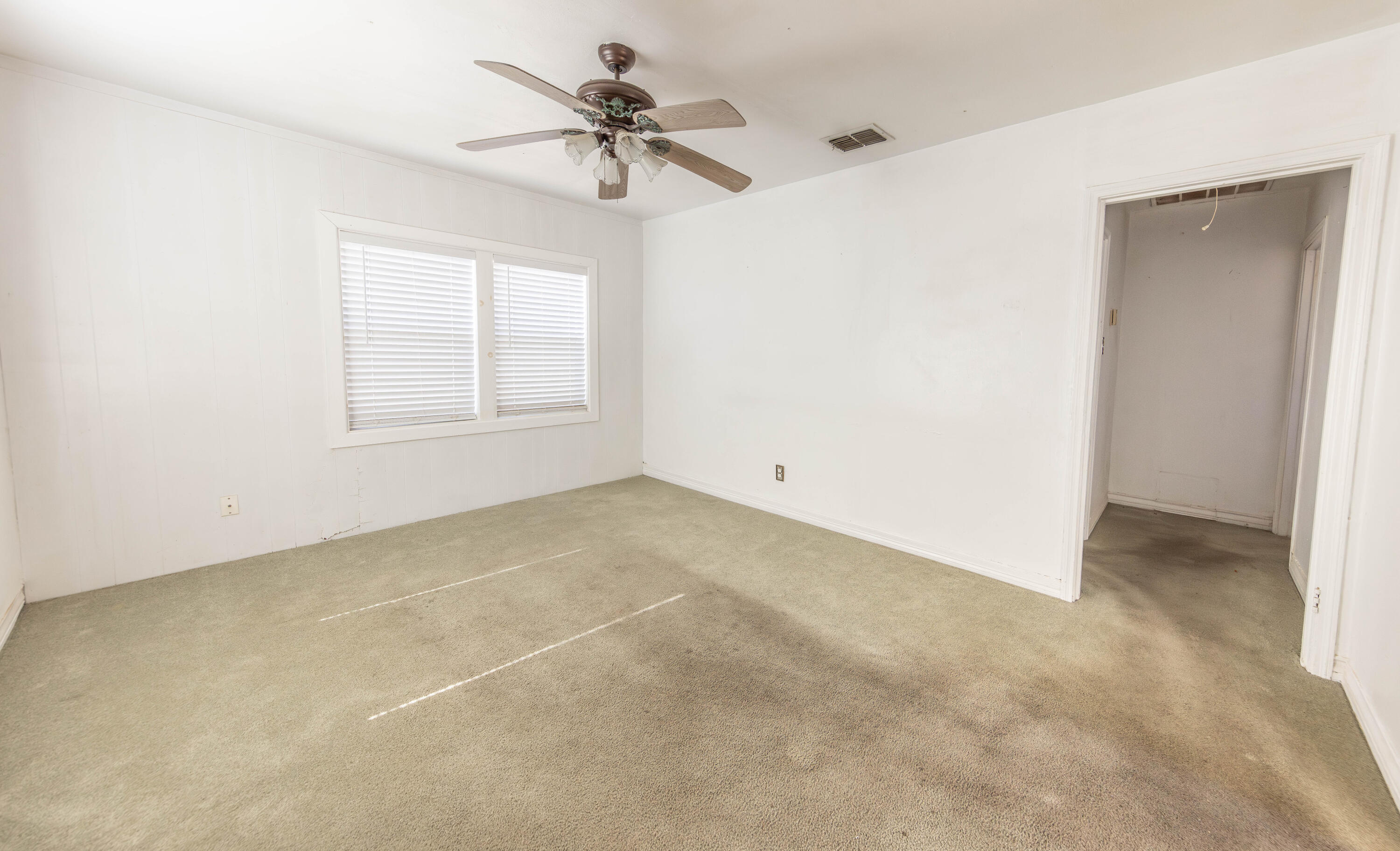 110 Uvalde Avenue Lubbock, TX 79415 - Photo 3 of 15 a view of an empty room with a window