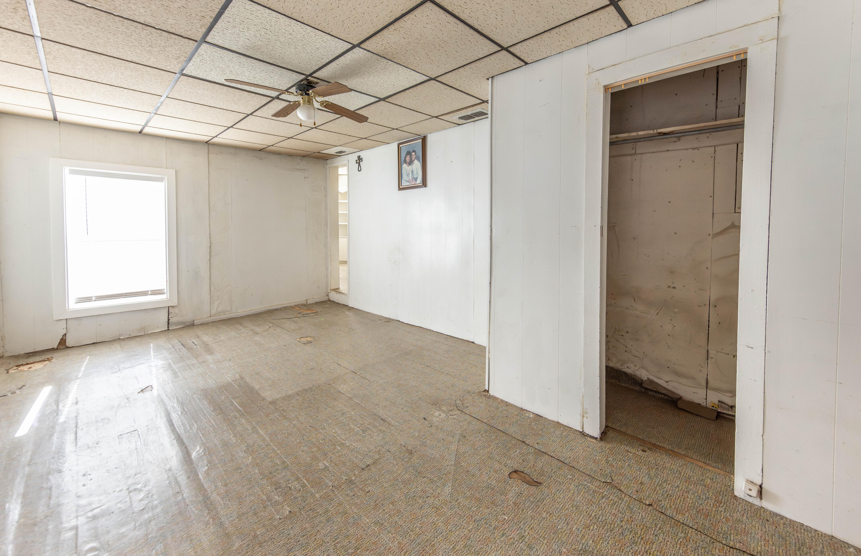 110 Uvalde Avenue Lubbock, TX 79415 - Photo 7 of 15 an empty room with windows