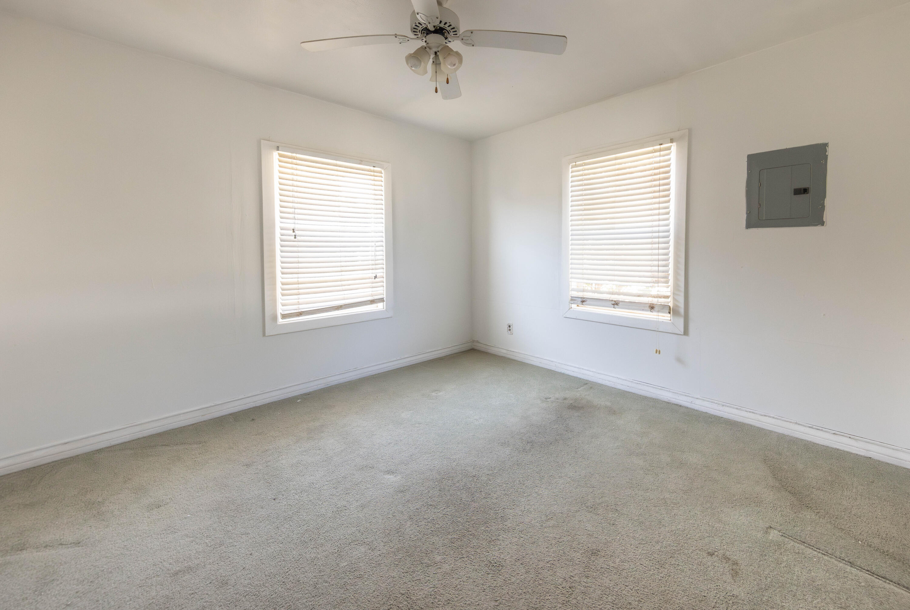 110 Uvalde Avenue Lubbock, TX 79415 - Photo 8 of 15 an empty room with a window