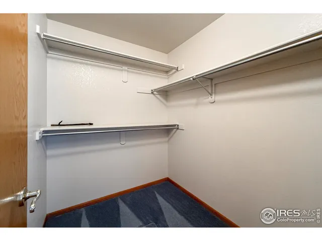 a view of an empty walk in closet