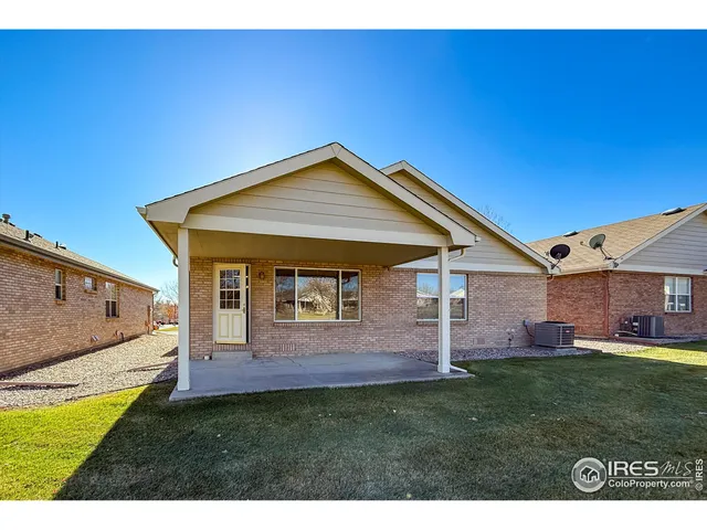 a view of house with backyard
