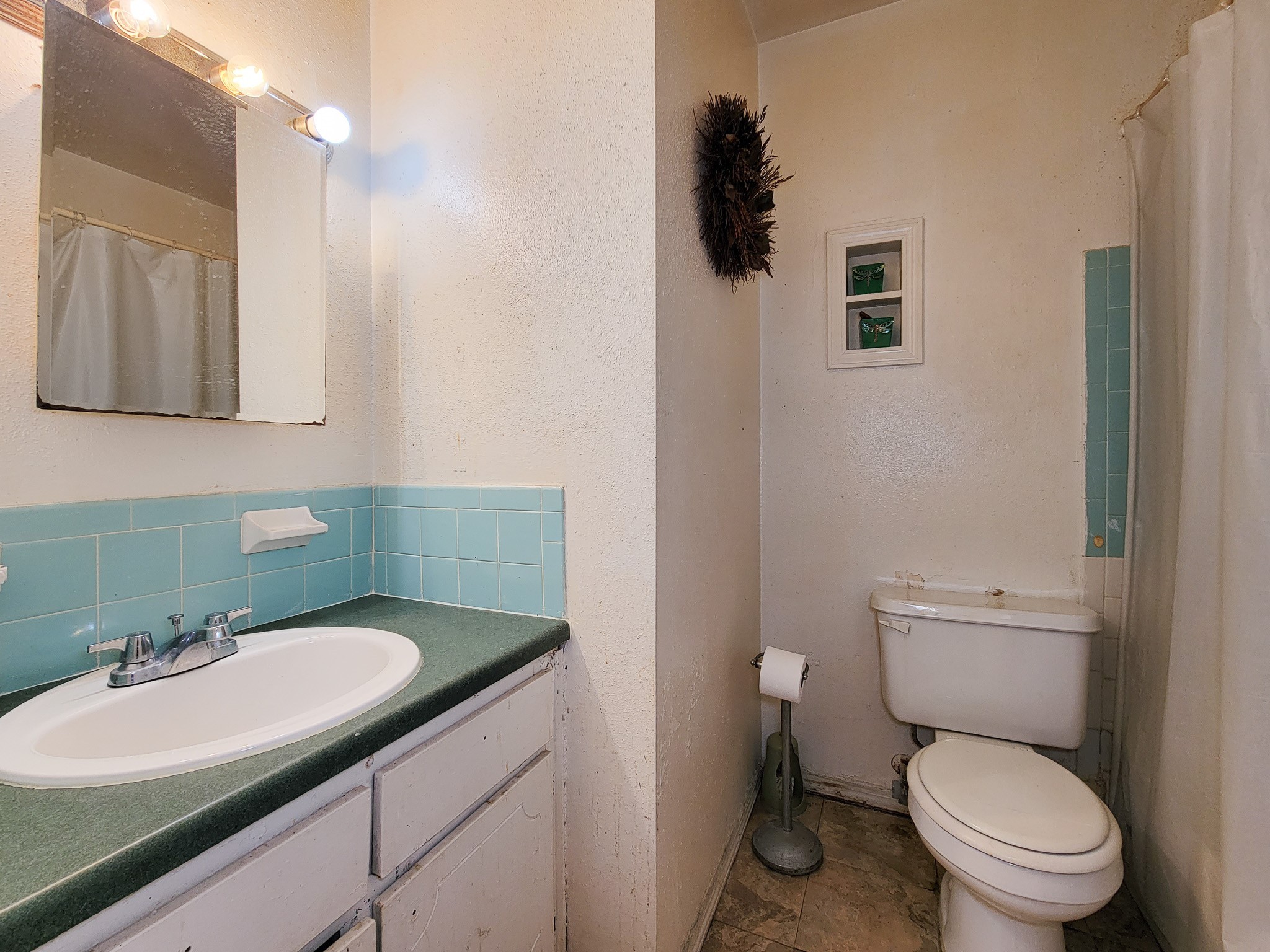 1330 Mosher Lane Houston, TX 77088 - Photo 12 of 16 a bathroom with a granite countertop toilet sink and mirror