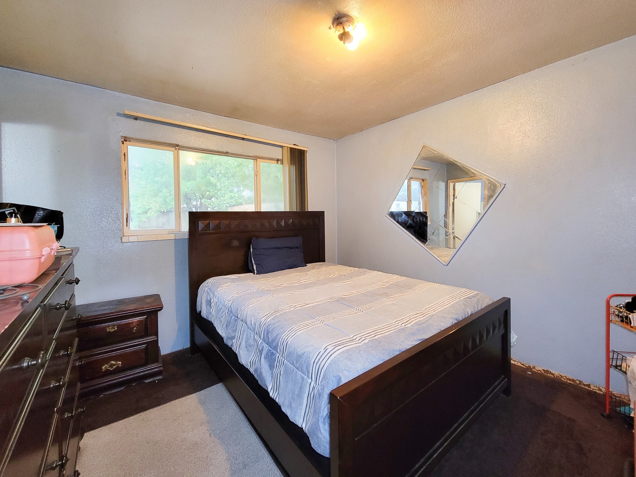 1330 Mosher Lane Houston, TX 77088 - Photo 13 of 16 a bedroom with a bed and a window