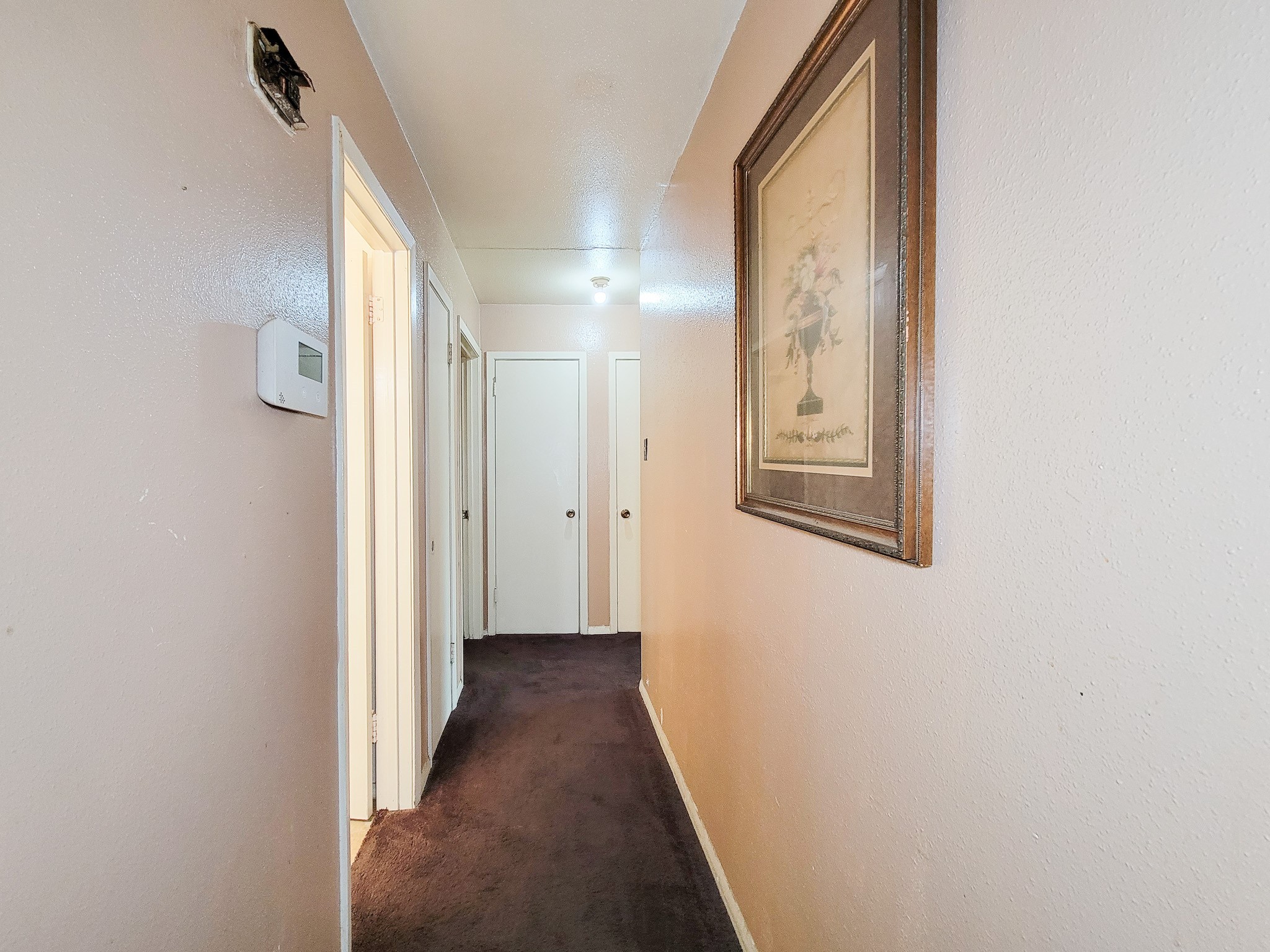 1330 Mosher Lane Houston, TX 77088 - Photo 15 of 16 a view of a hallway with wooden floor