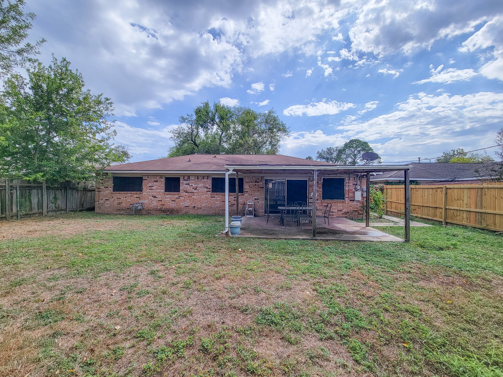 1330 Mosher Lane Houston, TX 77088 - Photo 16 of 16 a front view of a house with a yard and trees
