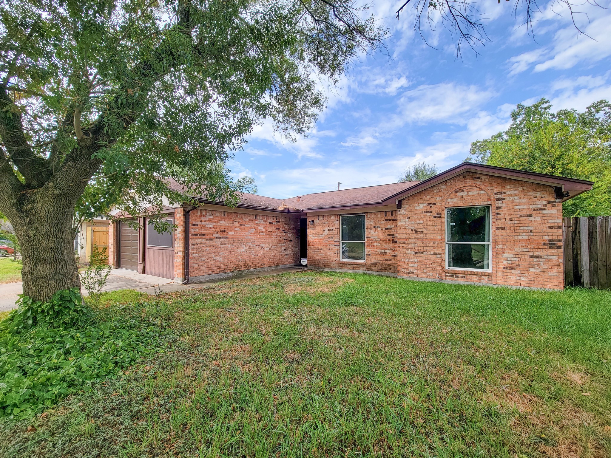 1330 Mosher Lane Houston, TX 77088 - Photo 2 of 16 a view of a yard in front of a house with large tree