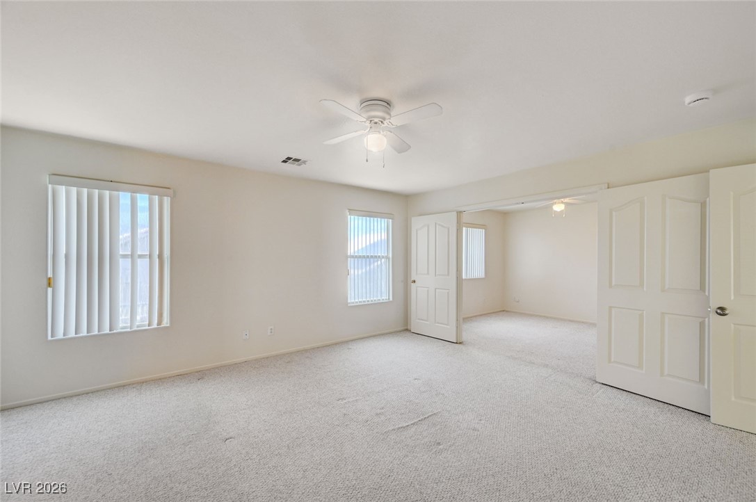 3901 Triora Street Las Vegas, NV 89129 - Photo 20 of 42 Carpeted empty room with a ceiling fan and baseboards