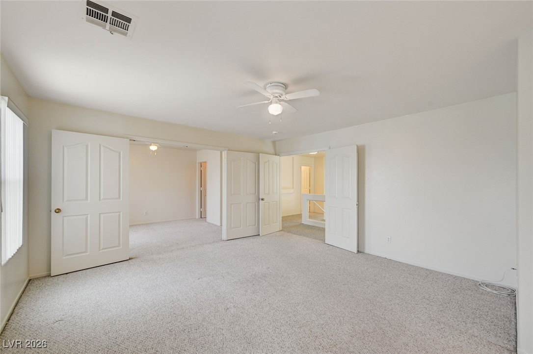 3901 Triora Street Las Vegas, NV 89129 - Photo 25 of 42 Unfurnished bedroom featuring carpet floors and a ceiling fan