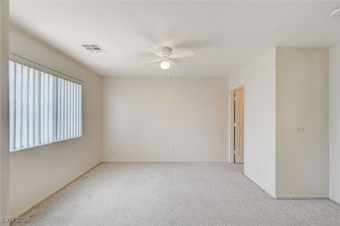 3901 Triora Street Las Vegas, NV 89129 - Photo 28 of 42 Carpeted spare room with a ceiling fan and baseboards