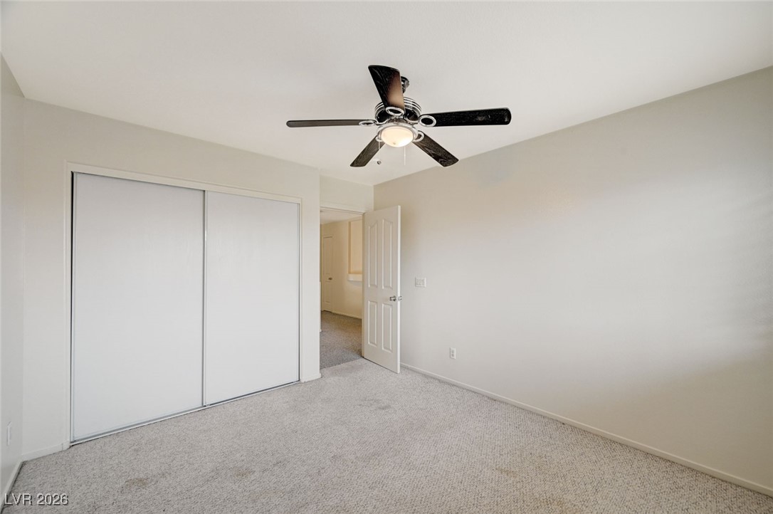 3901 Triora Street Las Vegas, NV 89129 - Photo 34 of 42 Unfurnished bedroom with carpet flooring, a closet, and ceiling fan