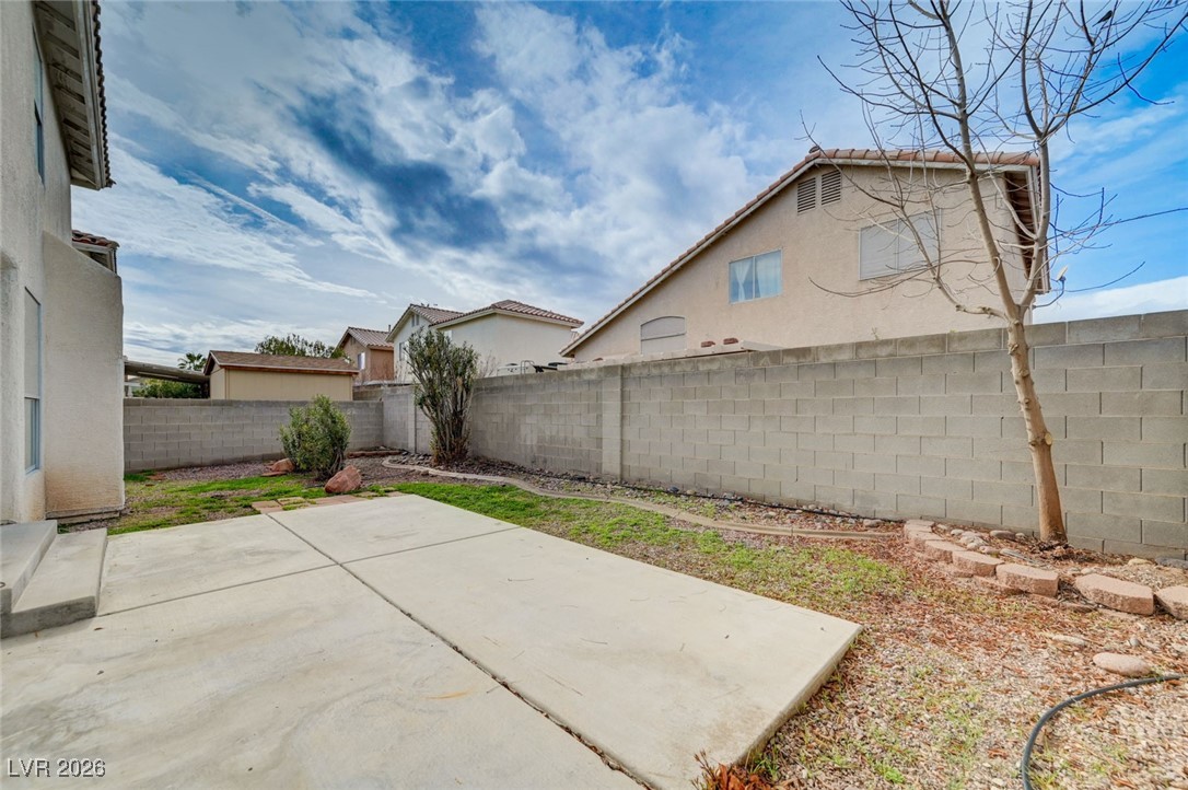 3901 Triora Street Las Vegas, NV 89129 - Photo 40 of 42 Fenced backyard featuring a patio area