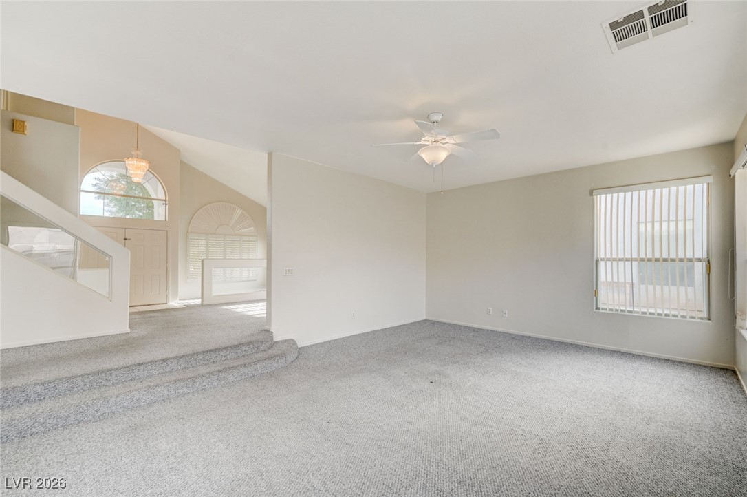 3901 Triora Street Las Vegas, NV 89129 - Photo 8 of 42 Spare room featuring stairs, carpet floors, and a ceiling fan