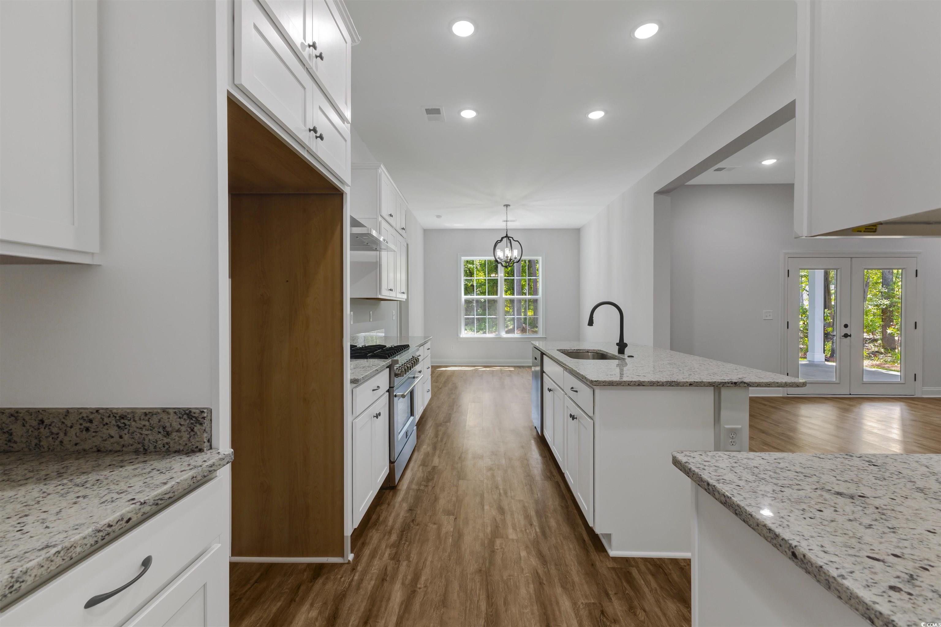 4121 Whatuthink Road Myrtle Beach, SC 29588 - Photo 12 of 28 Kitchen featuring appliances, white cabinetry, a sink, and recessed lighting