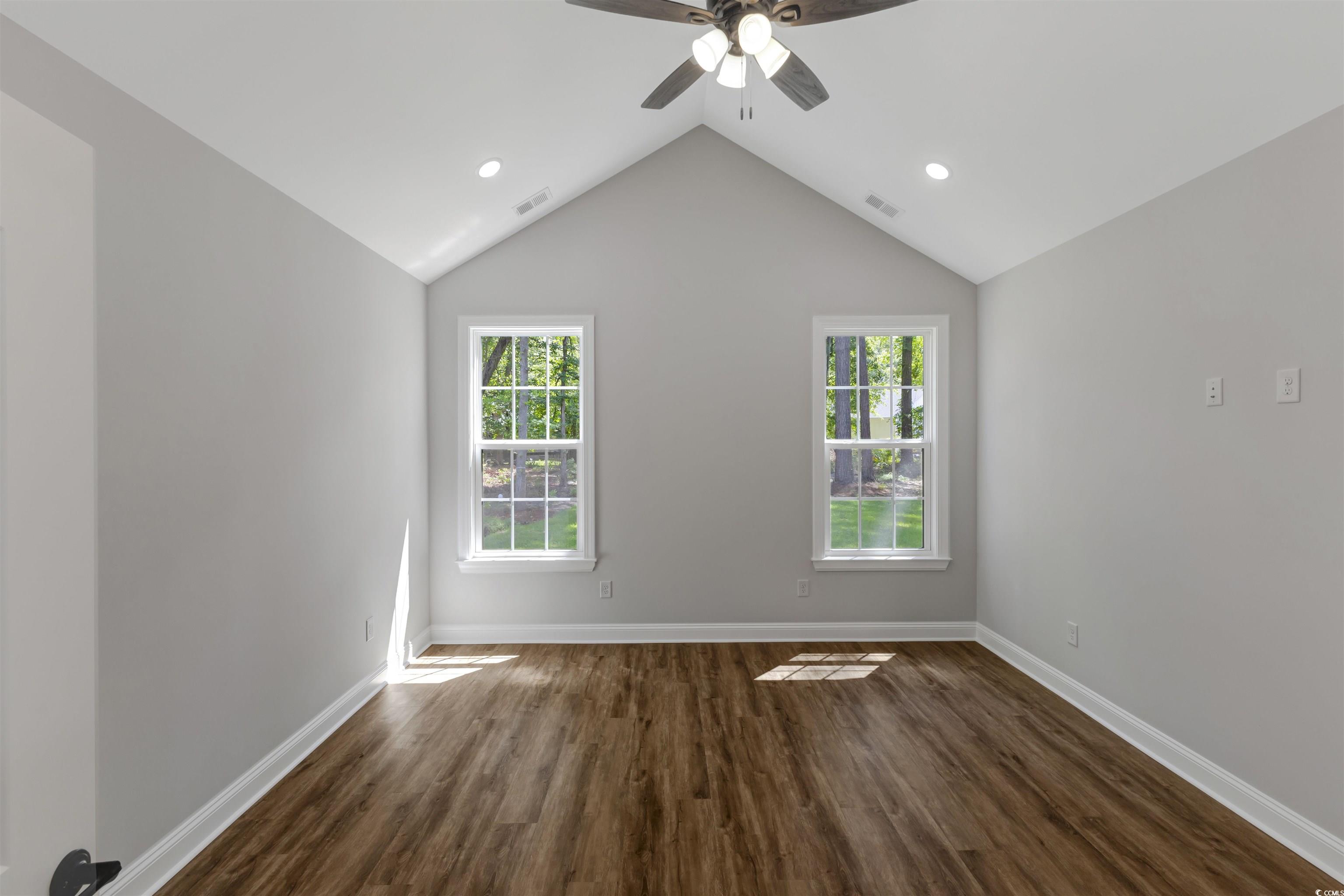 4121 Whatuthink Road Myrtle Beach, SC 29588 - Photo 15 of 28 Master Bedroom featuring plenty of natural light, LVP flooring, a ceiling fan, recessed lighting, and vaulted ceiling
