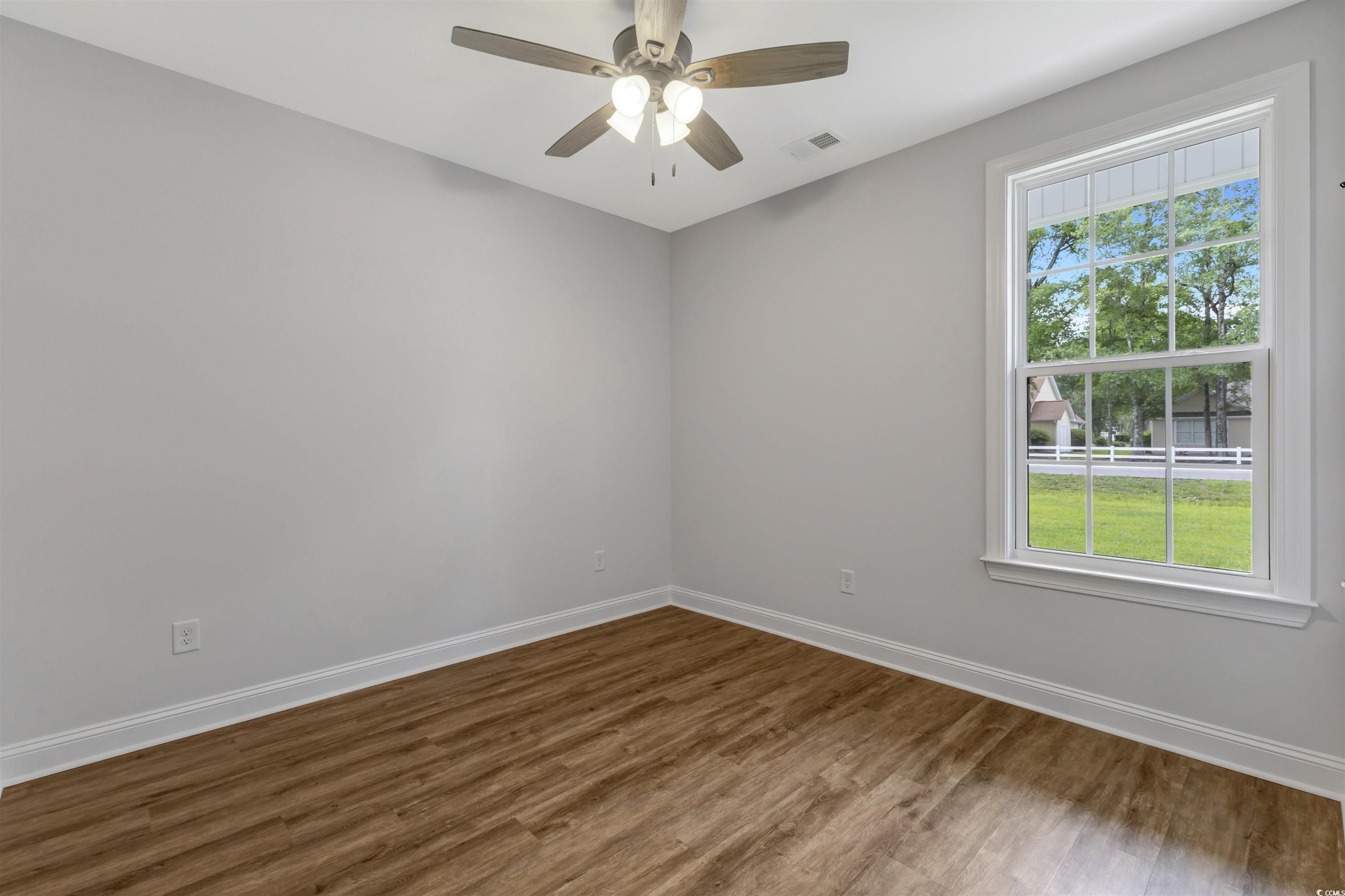 4121 Whatuthink Road Myrtle Beach, SC 29588 - Photo 25 of 28 Unfurnished Bedroom featuring LVP floors, baseboards, and ceiling fan