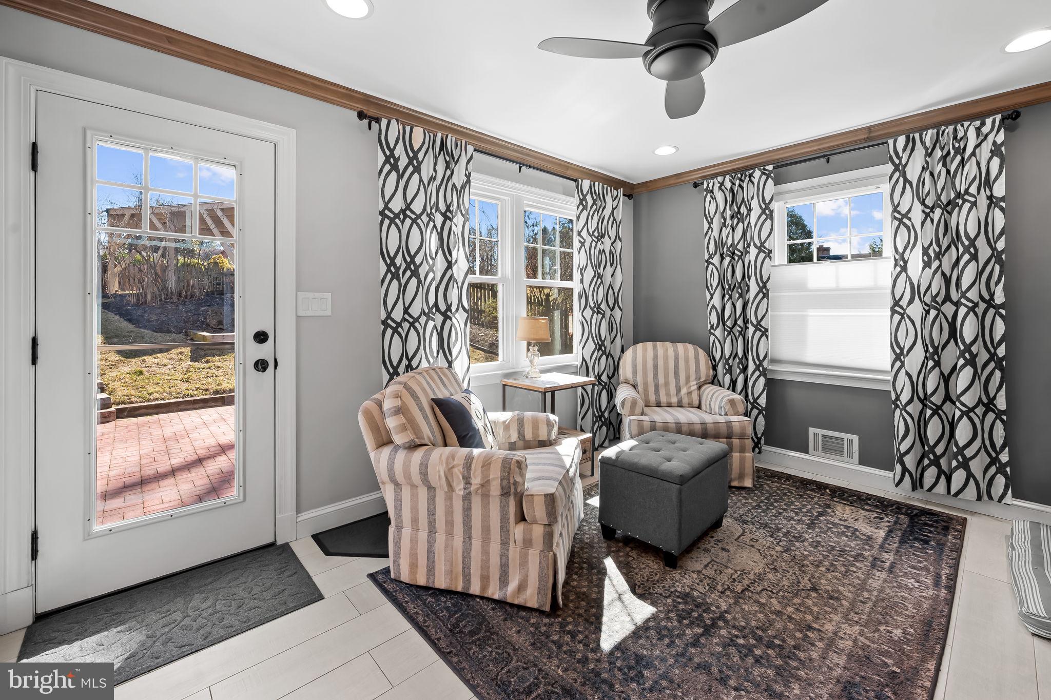 7919 Springway Road Towson, MD 21204 - Photo 14 of 46 a living room with furniture and windows