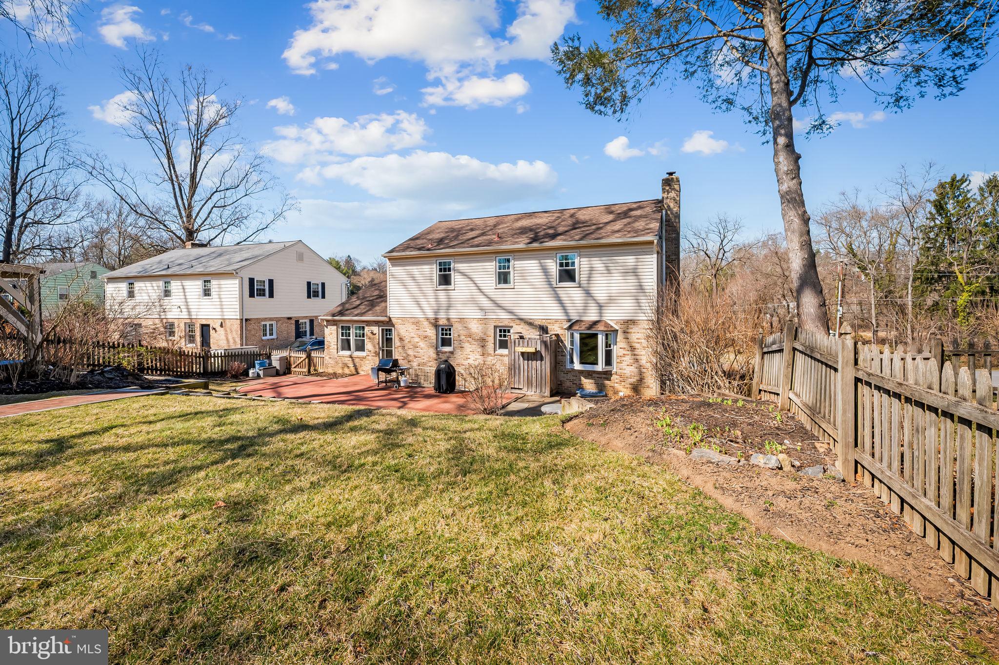 7919 Springway Road Towson, MD 21204 - Photo 37 of 46 a view of a house with a big yard and large tree