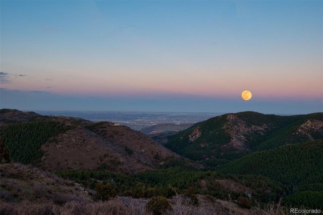 a view of sunset and mountains