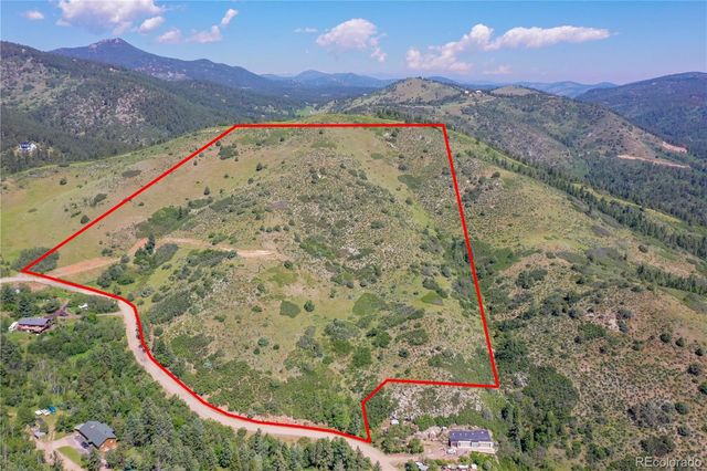 a view of a pathway with a mountain in the background