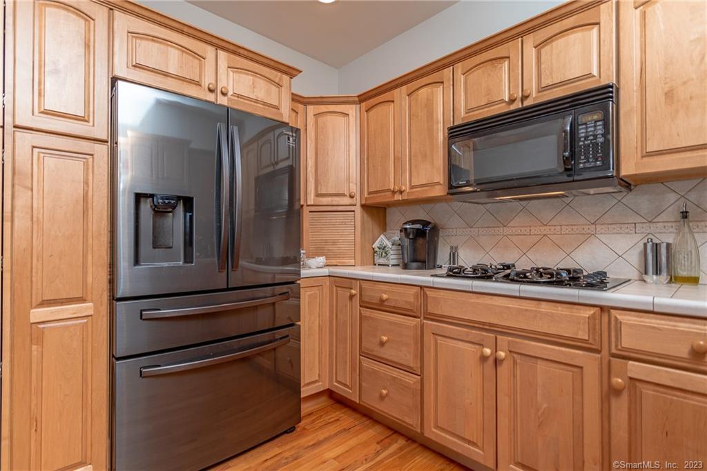 246 North Shore Road Killingly, CT 06241 - Photo 11 of 28 a kitchen with granite countertop stainless steel appliances and cabinets