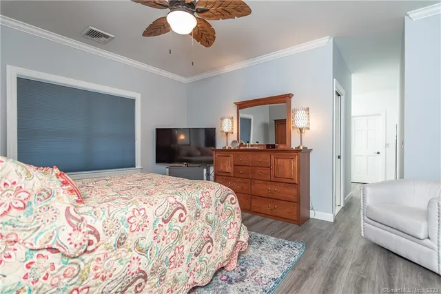 a bedroom with a bed and a dresser