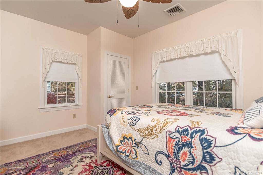246 North Shore Road Killingly, CT 06241 - Photo 19 of 28 a bedroom with a bed and a window