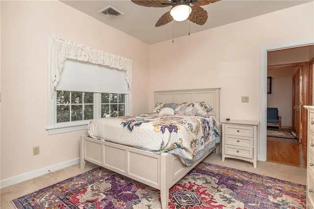 a large white bed in a white room