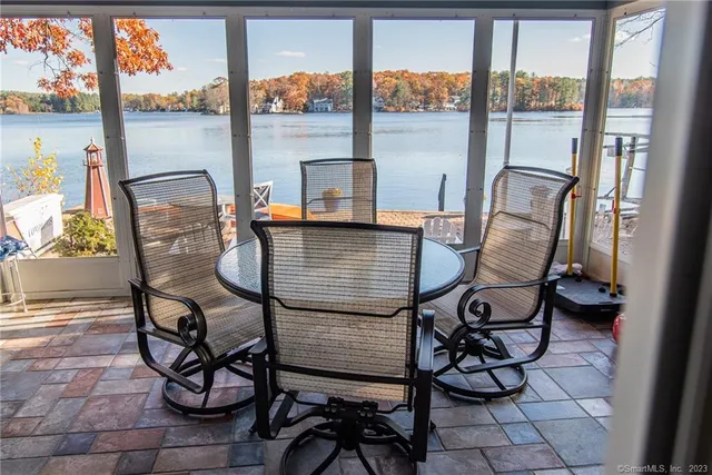 a view of a chairs and table in the balcony