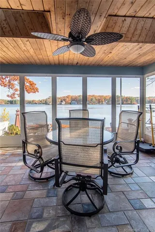 a view of a patio with table and chairs